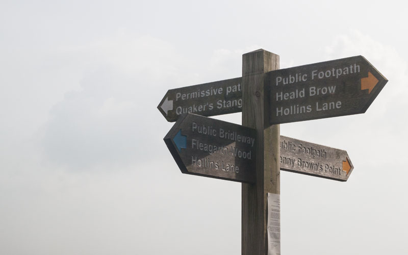 fingerpost at junction of paths near Quaker's Stang