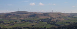view across valley to Scout Moor Wind Farm